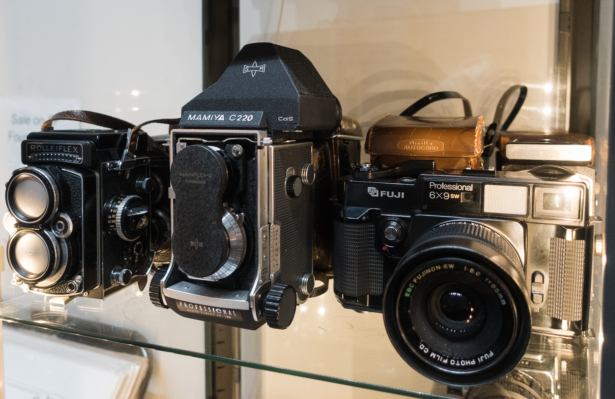 Three film cameras that are sold at Glass Key Photo.